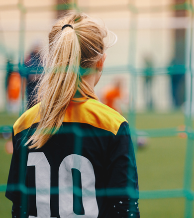 back of female goalkeeper with number 10 shirt