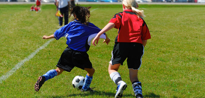 young footballers training on field