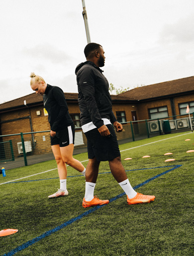 Kray Foster, professional football coach, and client on pitch training